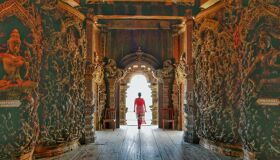 Buddhist Monk walking inside the Pagoda, Thailand
